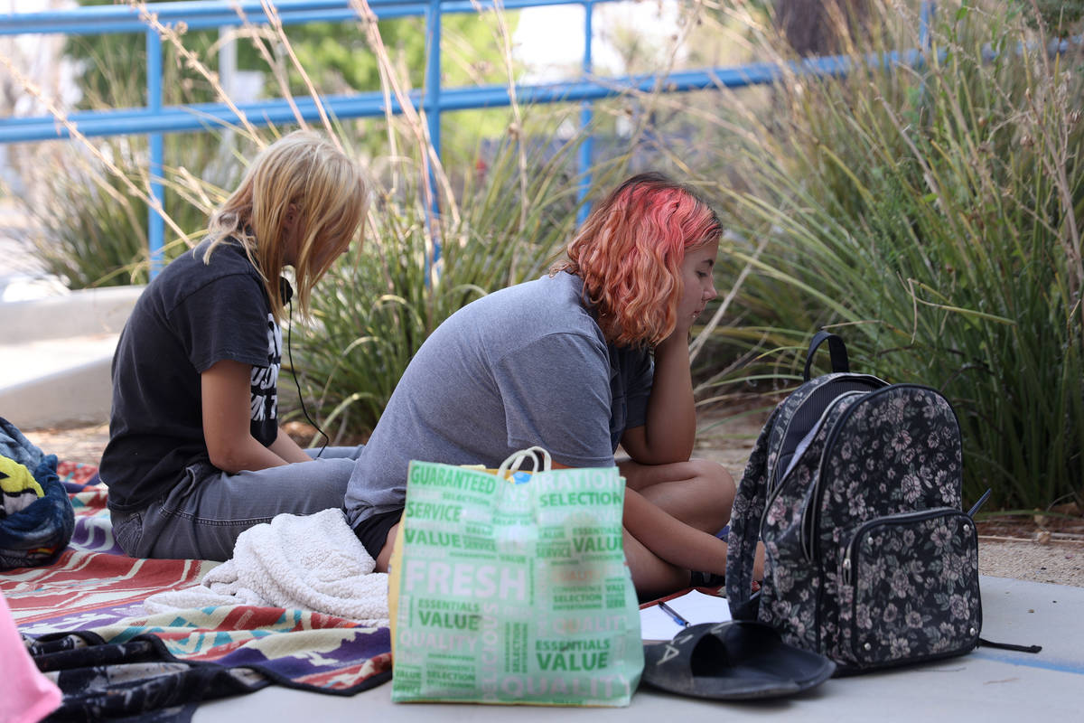 Shayne Dedmon, 13, left, and her Imogen, 15, participate in their virtual classes using the sch ...