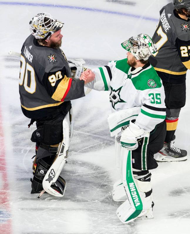 Dallas Stars goalie Anton Khudobin (35) and Vegas Golden Knights goalie Robin Lehner (90) shake ...