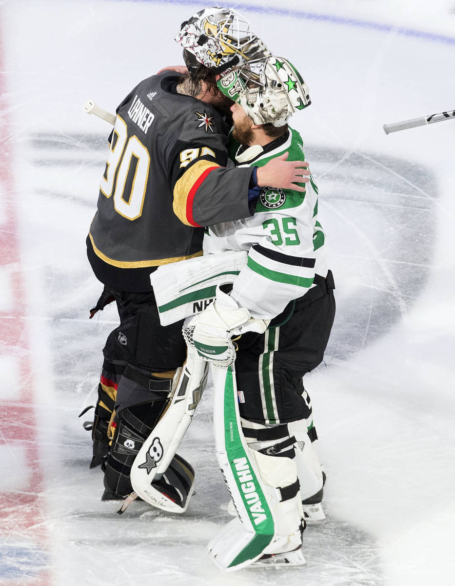 Dallas Stars goalie Anton Khudobin (35) and Vegas Golden Knights goalie Robin Lehner (90) hug a ...