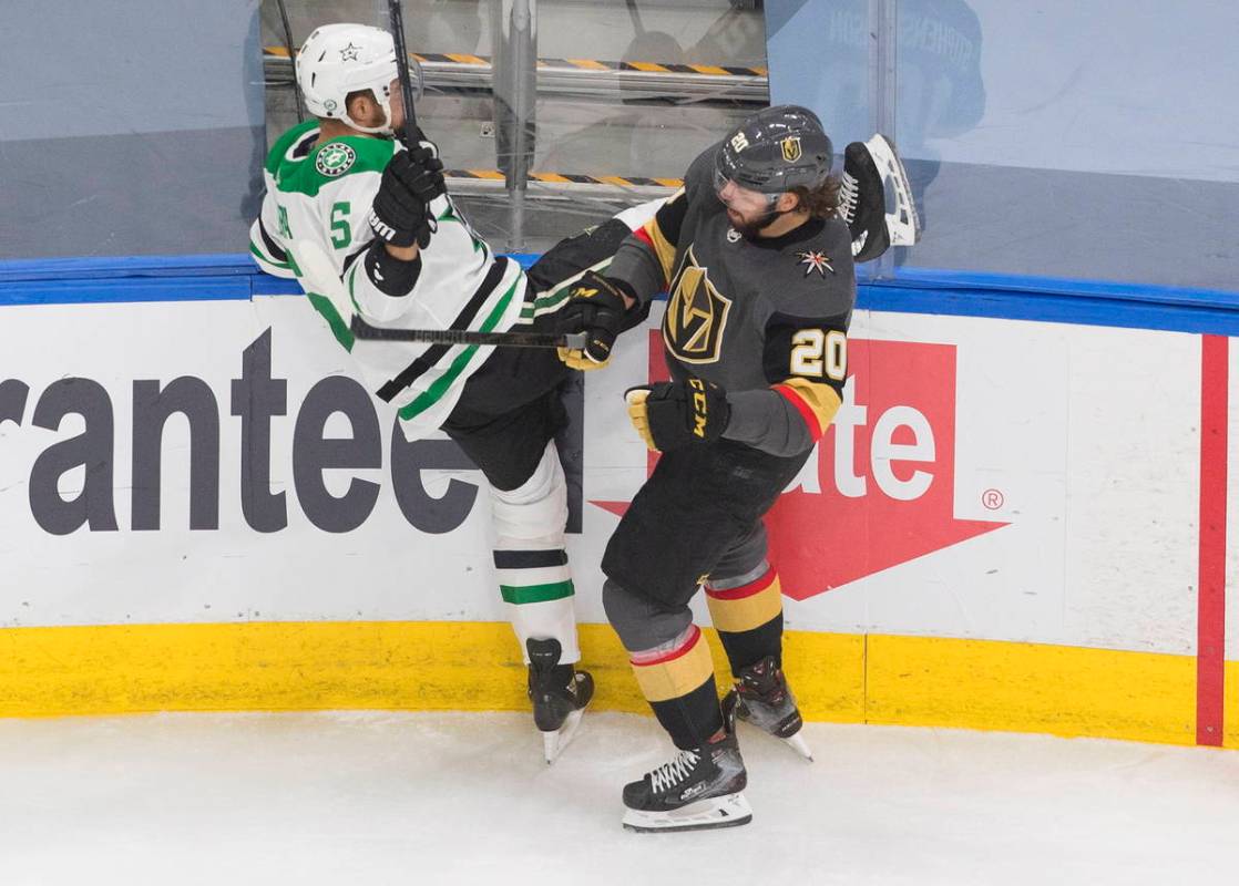 Dallas Stars' Andrej Sekera (5) is checked by Vegas Golden Knights' Chandler Stephenson (20) du ...