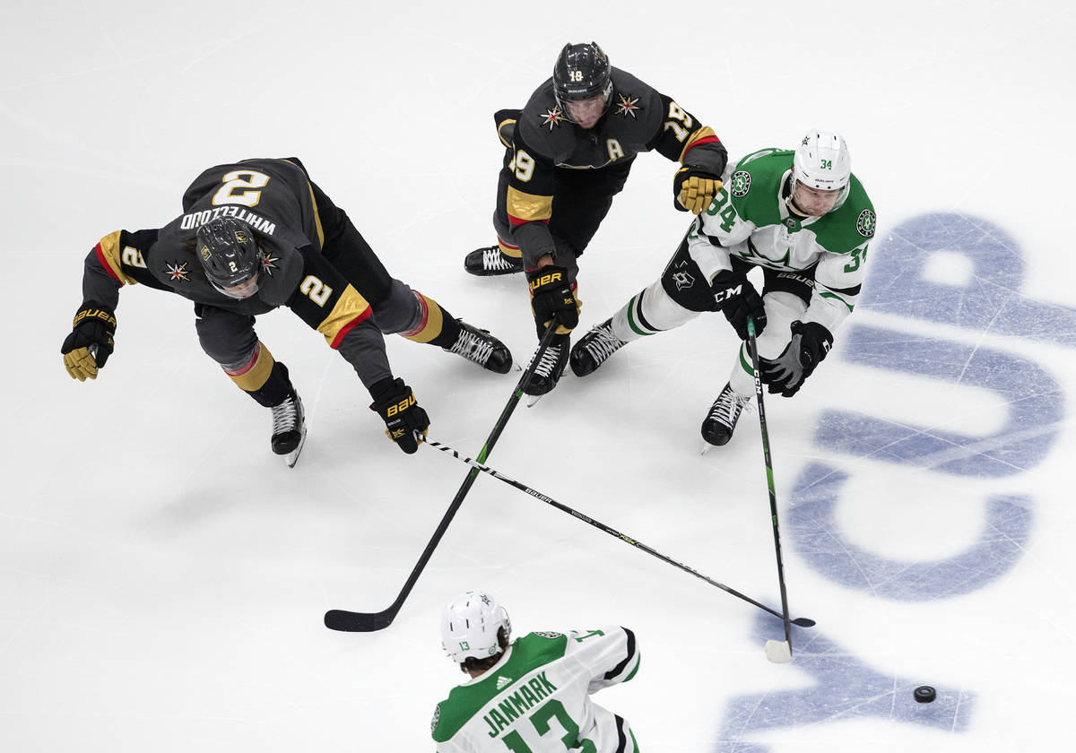 Dallas Stars' Denis Gurianov (34), Vegas Golden Knights' Reilly Smith (19) and Golden Knights' ...