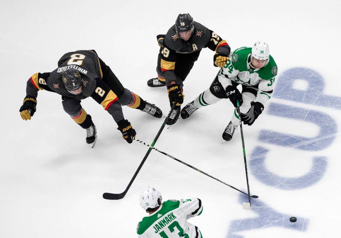 Dallas Stars' Denis Gurianov (34), Vegas Golden Knights' Reilly Smith (19) and Golden Knights' ...