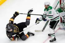 Dallas Stars' Joe Pavelski (16) checks Vegas Golden Knights' Nicolas Roy (10) during second-per ...