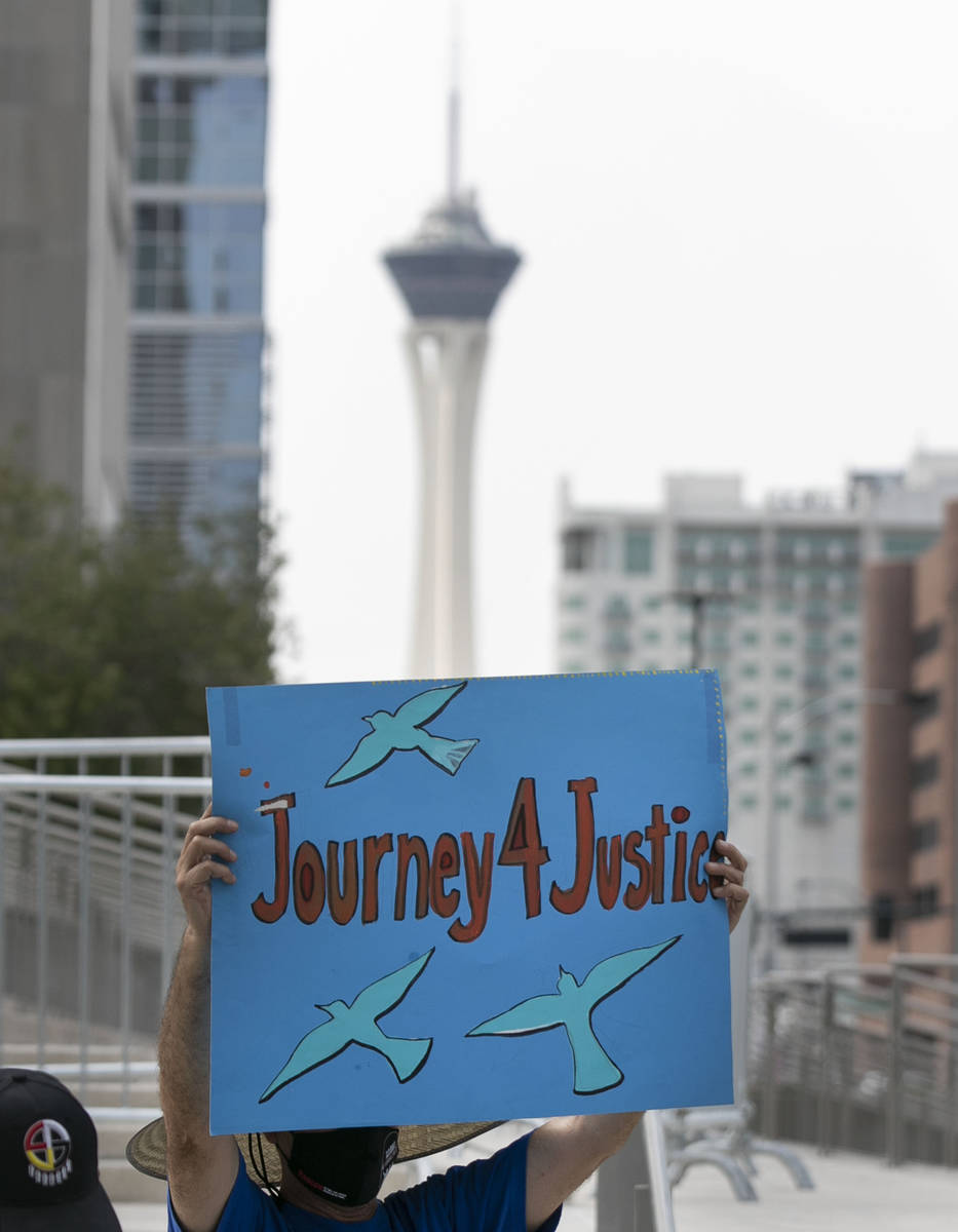 Eleazar Castellanos holds a sign as Temporary Protective Status (TPS) holders and community par ...