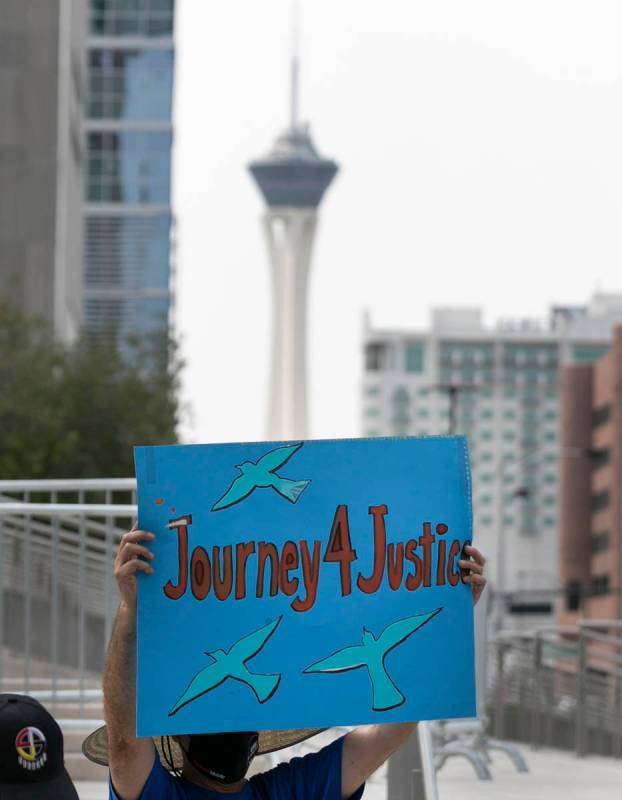 Eleazar Castellanos holds a sign as Temporary Protective Status (TPS) holders and community par ...