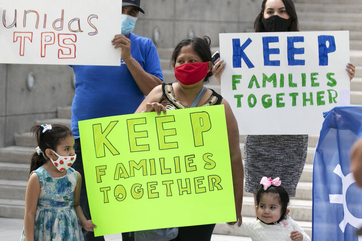 Janette Rivera, center, her daughters Daniella, 5, and Sofia, 2, join Temporary Protective Stat ...