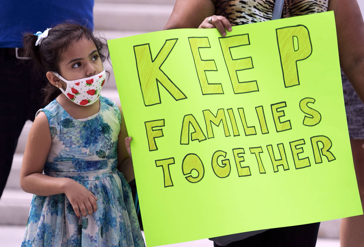 Daniella Rivera, 5, watches as Temporary Protective Status (TPS) holders and community partners ...