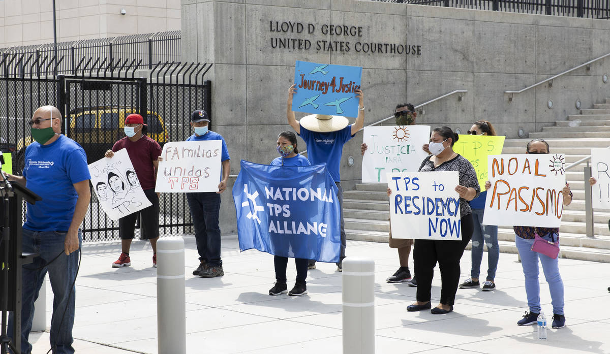 Miguel Barahona, left, member of the TPS committee of Las Vegas, speaks as Temporary Protective ...