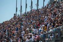 Race fans watch the South Point 400 NASCAR Cup Series auto race at the Las Vegas Motor Speedway ...