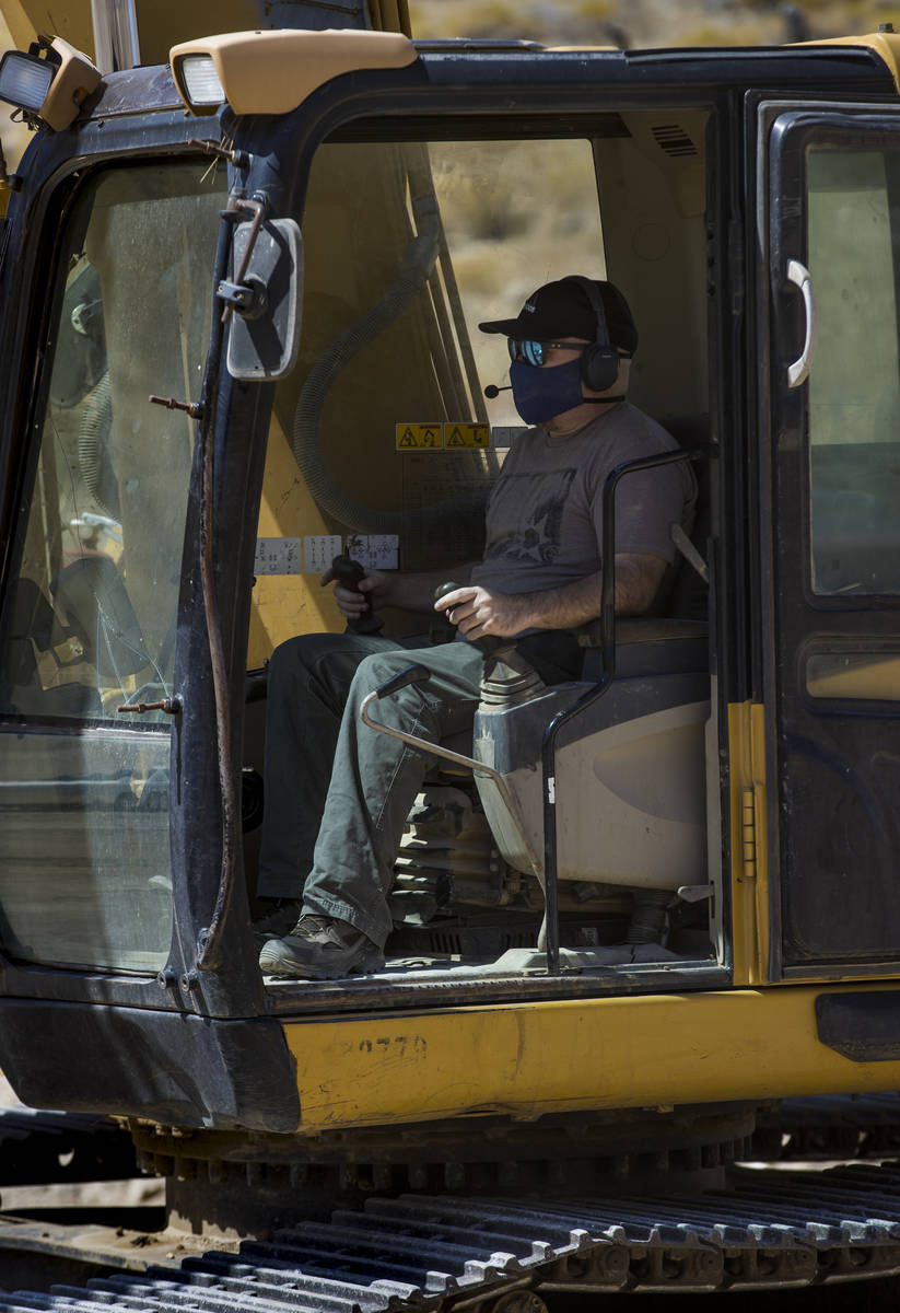 Christopher Lawrence operates a Caterpillar Excavator, one of the extreme outdoor entertainment ...