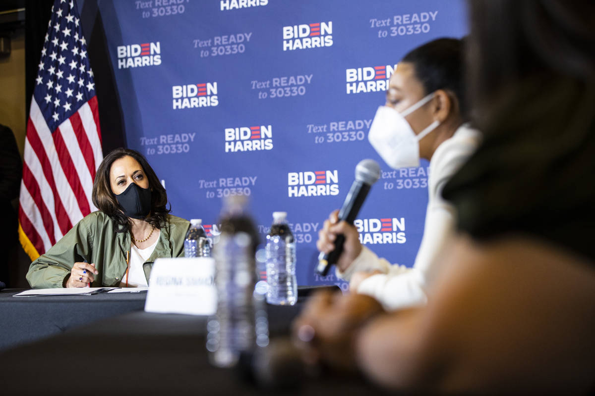 Democratic vice presidential candidate Sen. Kamala Harris, D-Calif., listens during a roundtabl ...