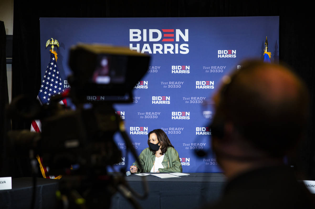 Democratic vice presidential candidate Sen. Kamala Harris, D-Calif., listens during a roundtabl ...