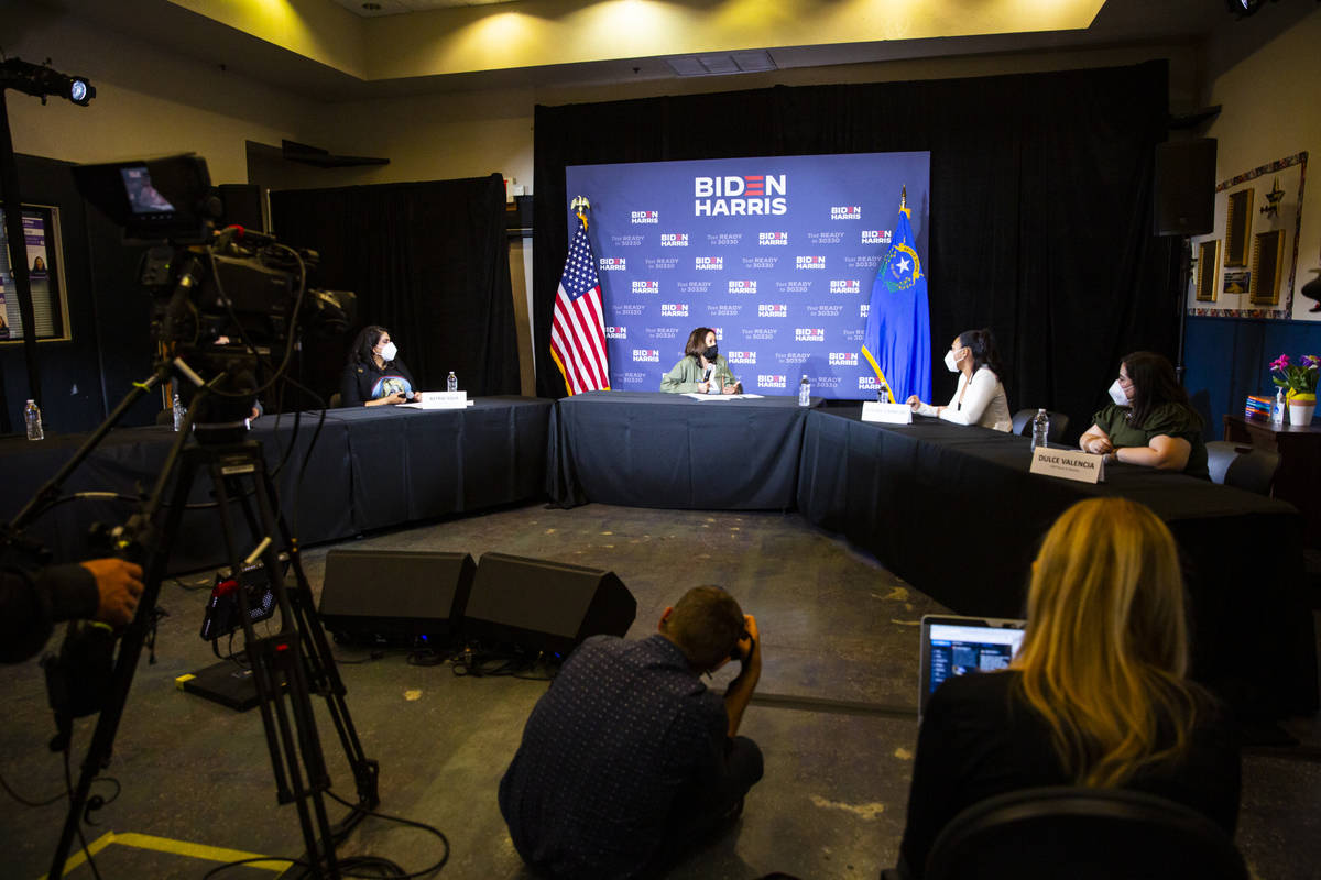 Democratic vice presidential candidate Sen. Kamala Harris, D-Calif., center, speaks during a ro ...
