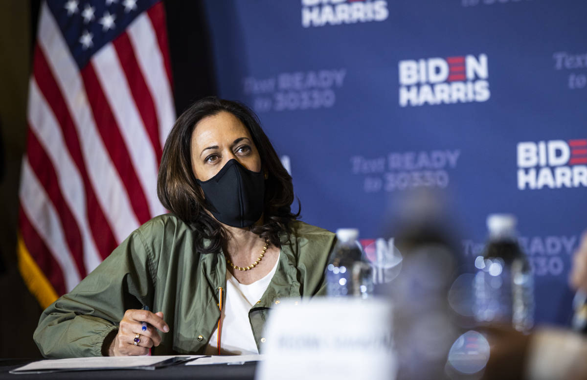 Democratic vice presidential candidate Sen. Kamala Harris, D-Calif., listens during a roundtabl ...