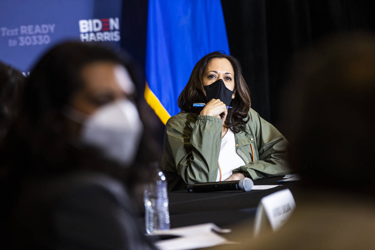 Democratic vice presidential candidate Sen. Kamala Harris, D-Calif., listens during a roundtabl ...