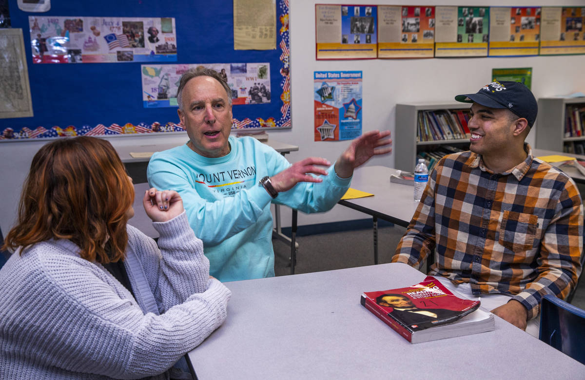 Leavitt Middle School history teacher Mitchell Kalin, center, talks about their class experienc ...