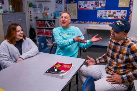 Leavitt Middle School history teacher Mitchell Kalin, center, talks about their class experienc ...