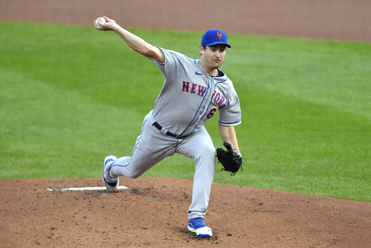 New York Mets starting pitcher Seth Lugo throws to a Toronto Blue Jays batter during the first ...
