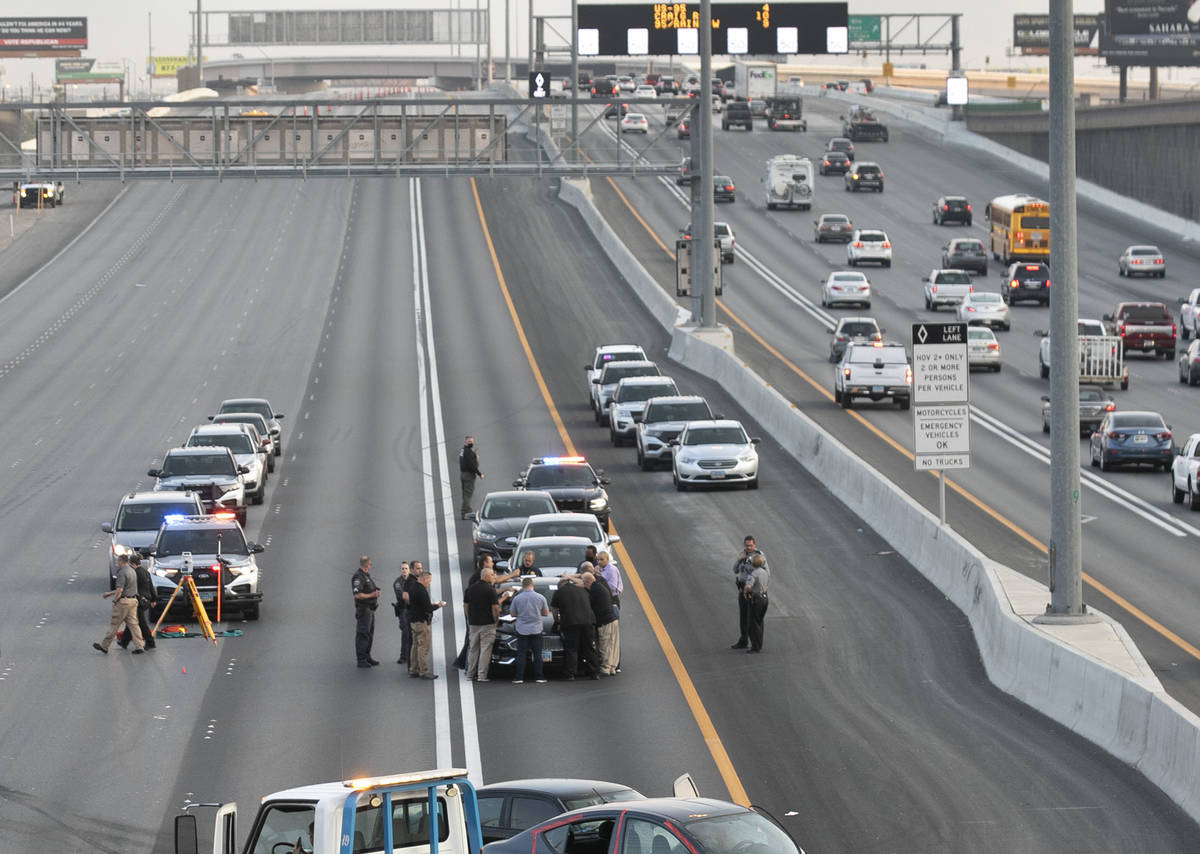 A team of officers and detectives investigate on Southbound I-15 near Flamingo exit on Wednesda ...