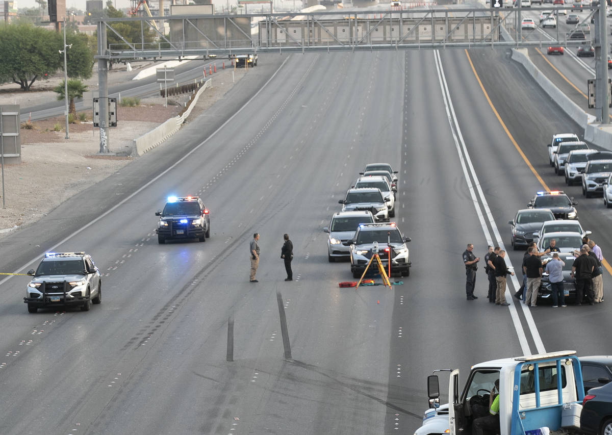 A team of officers and detectives investigate on Southbound I-15 near Flamingo exit on Wednesda ...