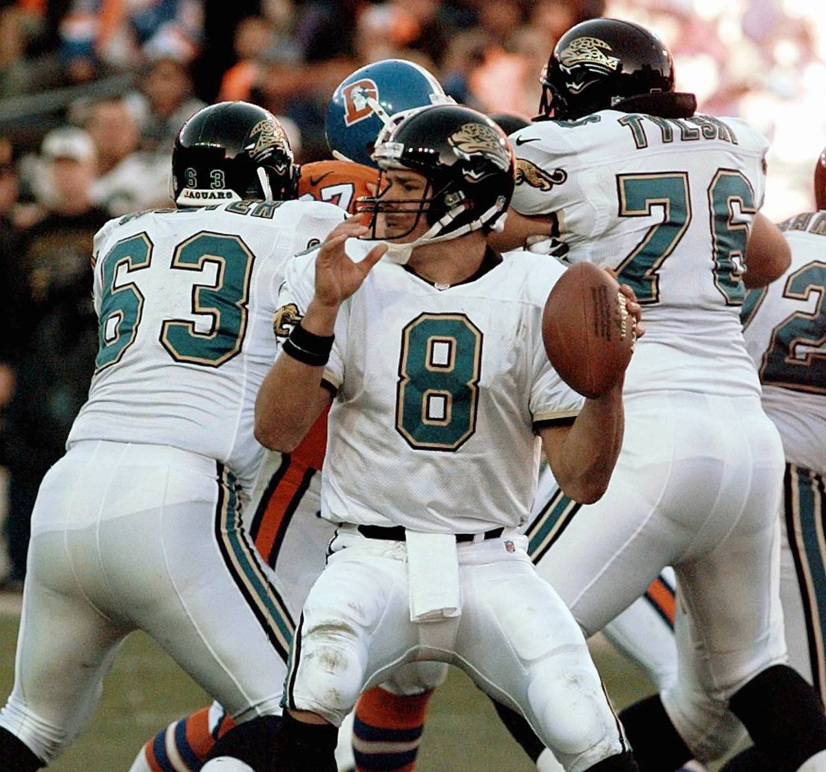 Jacksonville Jaguars quarterback Mark Brunell looks for an open man during the third quarter ag ...