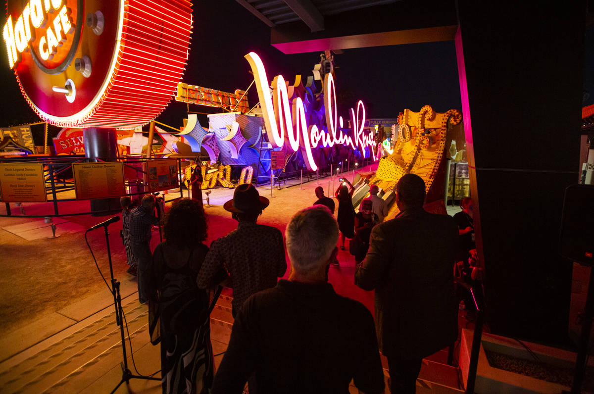 Rob McCoy, president and CEO of the Neon Museum,ʣenter, watches alongside Dee Dee Jasmine ...