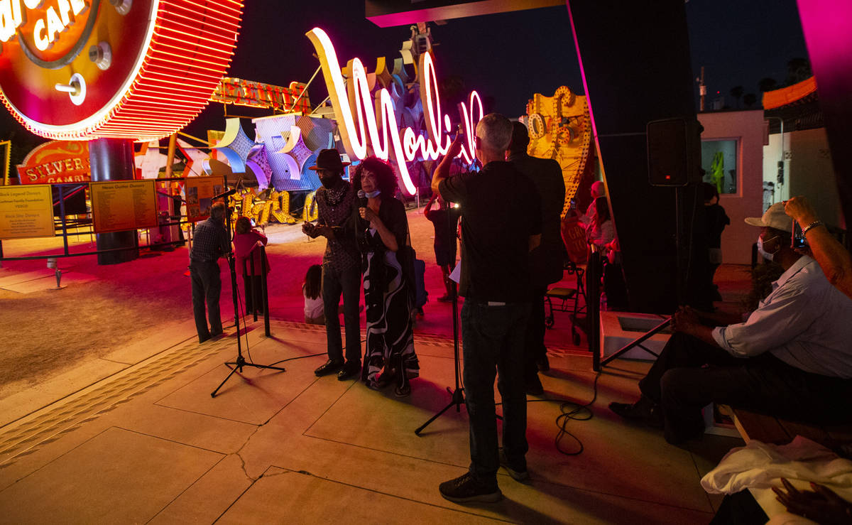 Dee Dee Jasmine, a dancer who performed at the Moulin Rouge, center left, leads the countdown t ...