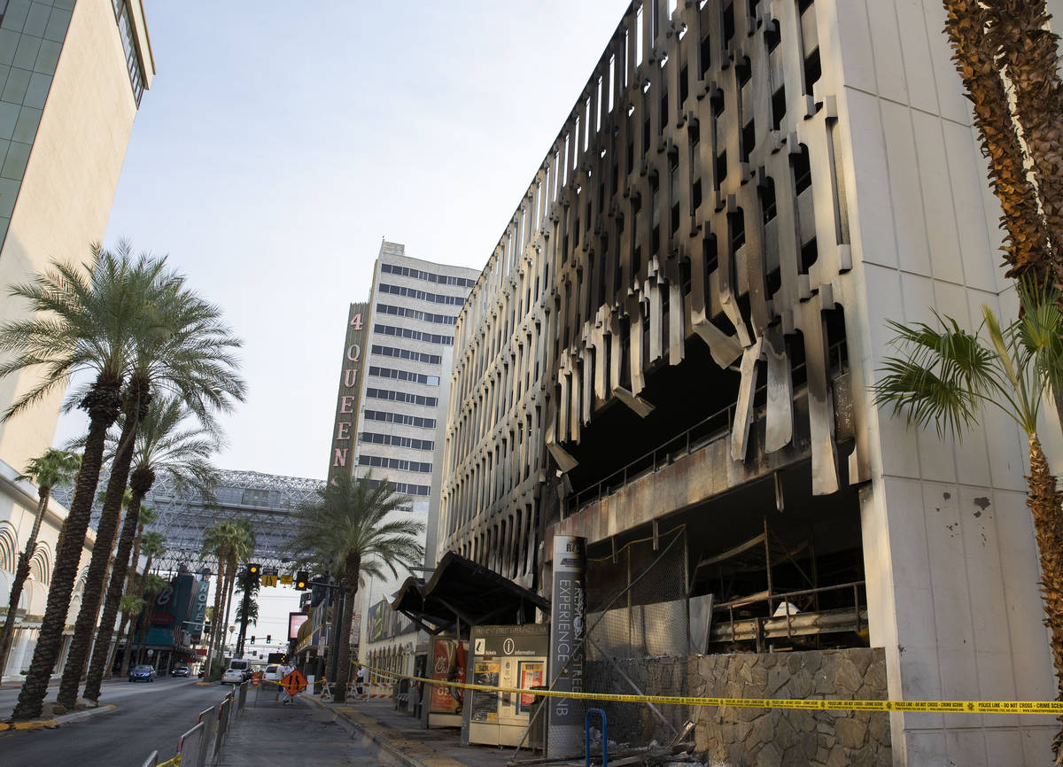 At least five vehicles caught fire on the first level of the 4 Queens hotel-casino parking gara ...