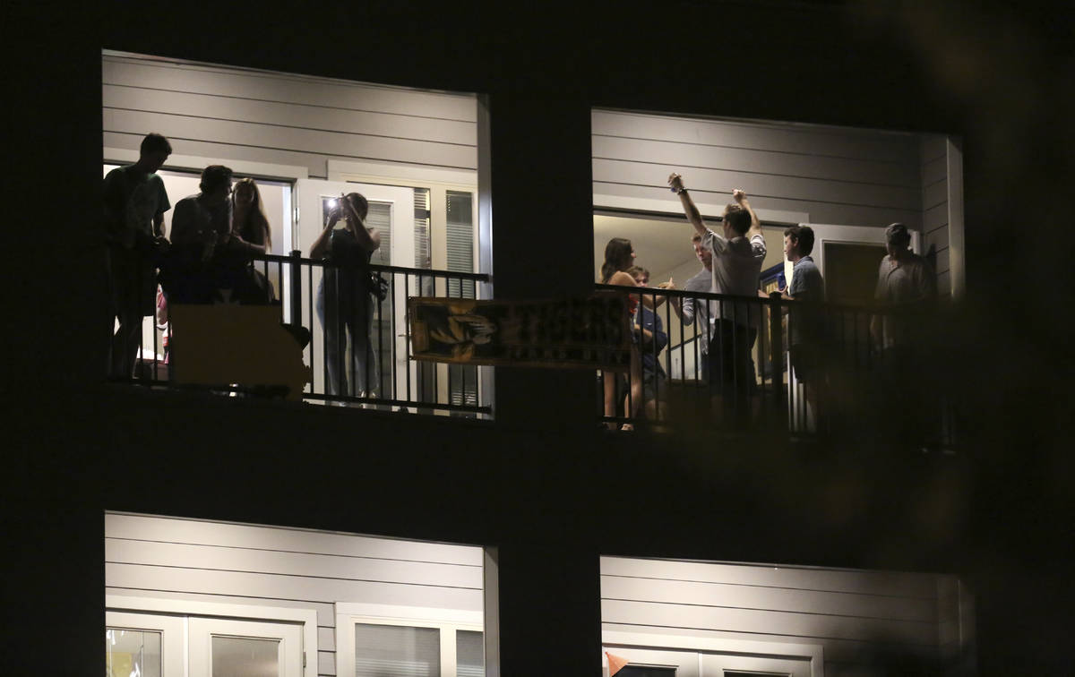 FILE - In this Sept. 1, 2020 file photo, partiers congregate on the balcony of a downtown apart ...