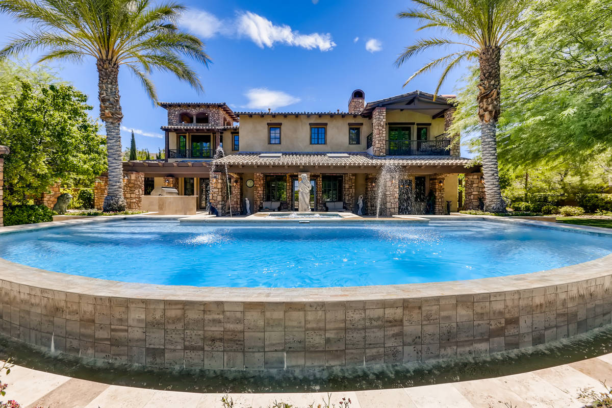 This home at 2 Olympia Hills Circle sits on the golf course at Southern Highlands Country Club. ...