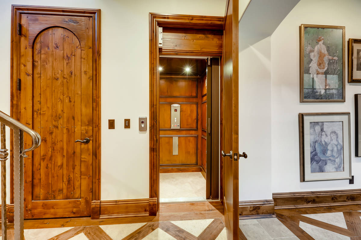 The two-story, 9,741-square-foot main house has an elevator that connects the levels. (The Cram ...