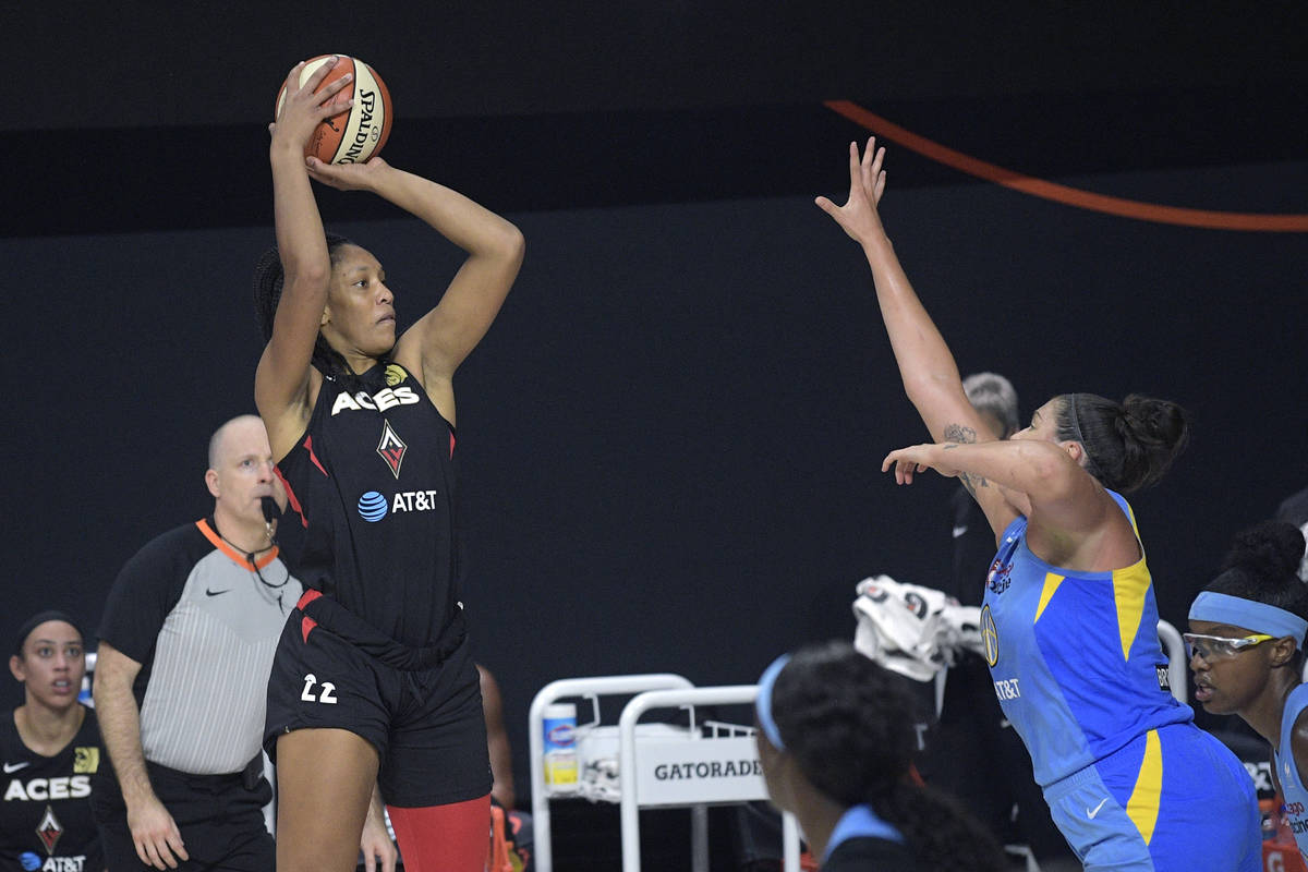 Las Vegas Aces center A'ja Wilson (22) goes up for a shot in front of Chicago Sky center Stefan ...