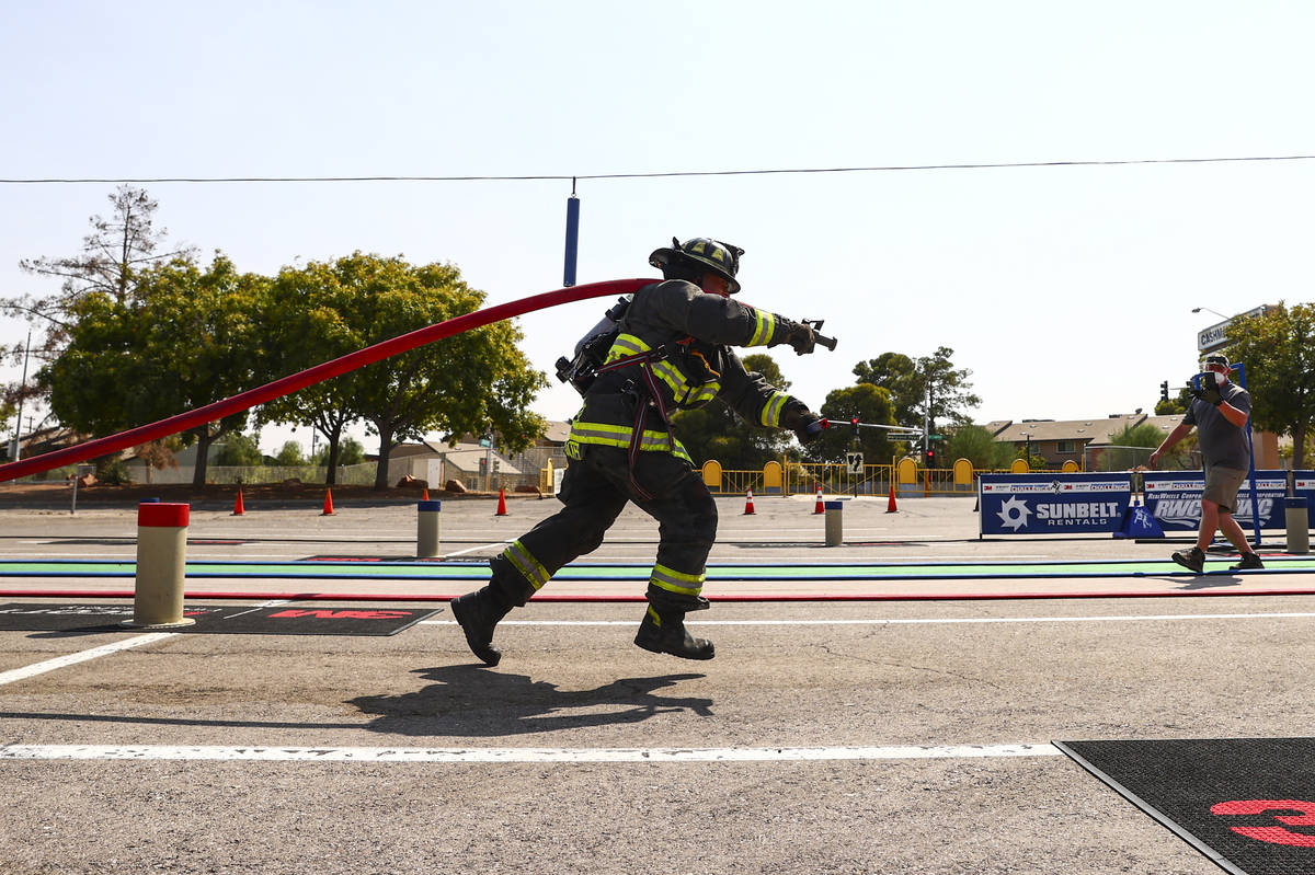 North Las Vegas firefighter Jason Coates competes in the Firefighter Combat Challenge outside o ...