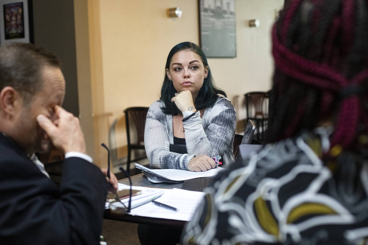 Alisha Burns speaks with her lawyer Tony Abbatangelo, left, and program manager for The Cupcake ...