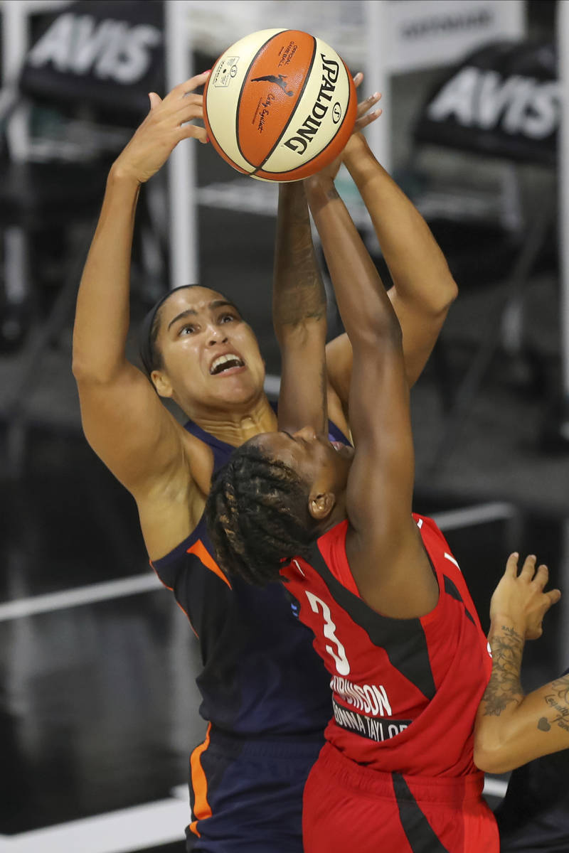 Connecticut Sun's Brionna Jones blocks a shot by Las Vegas Aces' Danielle Robinson (3) during t ...