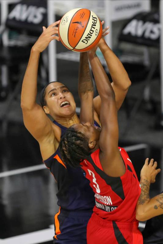 Connecticut Sun's Brionna Jones blocks a shot by Las Vegas Aces' Danielle Robinson (3) during t ...