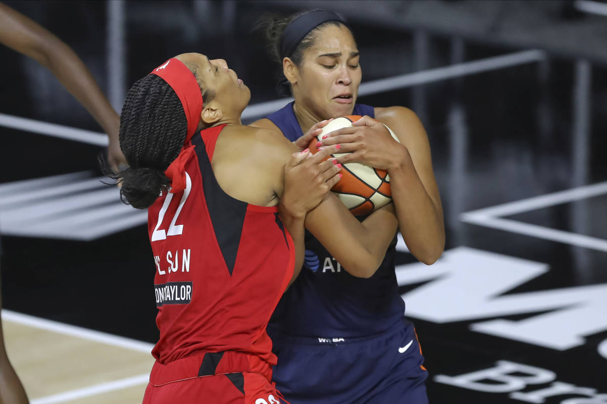 Connecticut Sun's Brionna Jones, right, steals the ball from Las Vegas Aces' A'ja Wilson during ...