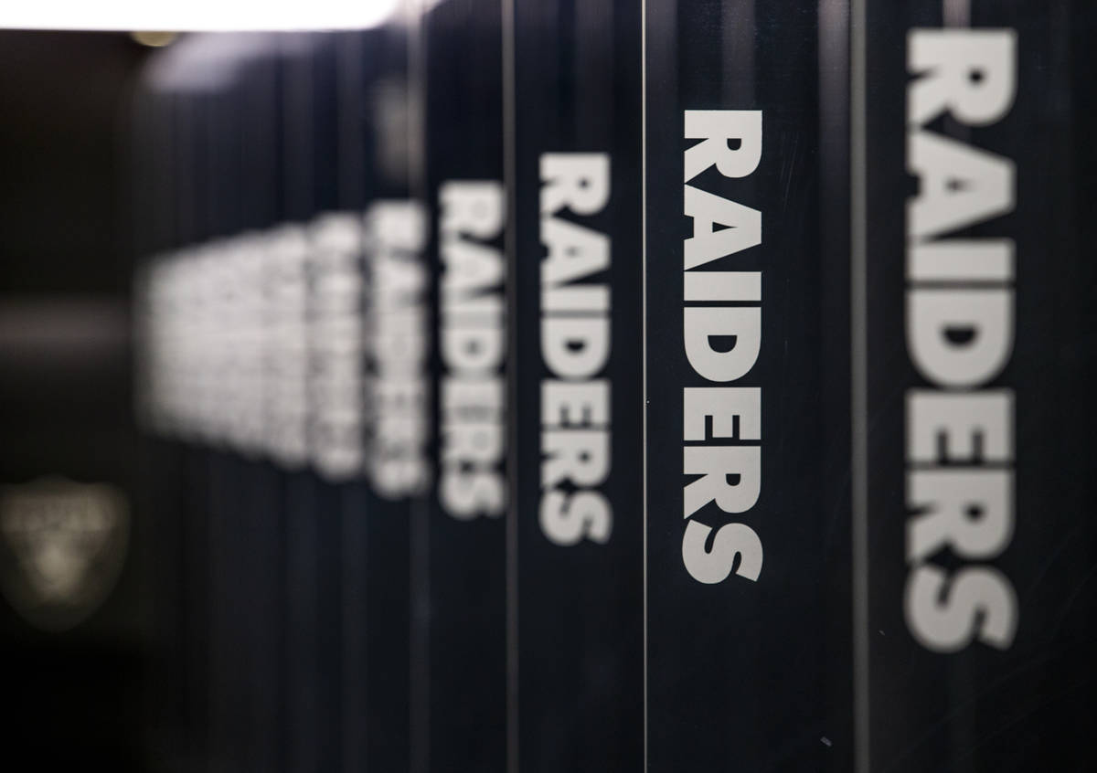 Each Las Vegas Raiders player locker space is separated by a glass partition at Allegiant Stadi ...