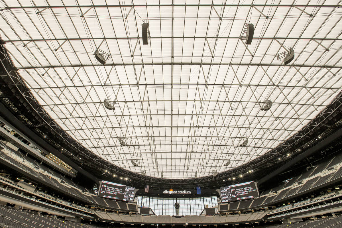 The staff at Allegiant Stadium works to finalize the preparations before the Las Vegas Raiders ...