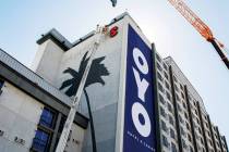 A crane takes down the Hooters sign from the former Hooters Hotel in Las Vegas, Tuesday, Sept. ...