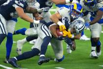Los Angeles Rams linebacker Troy Reeder, back, tackles Dallas Cowboys running back Tony Pollard ...