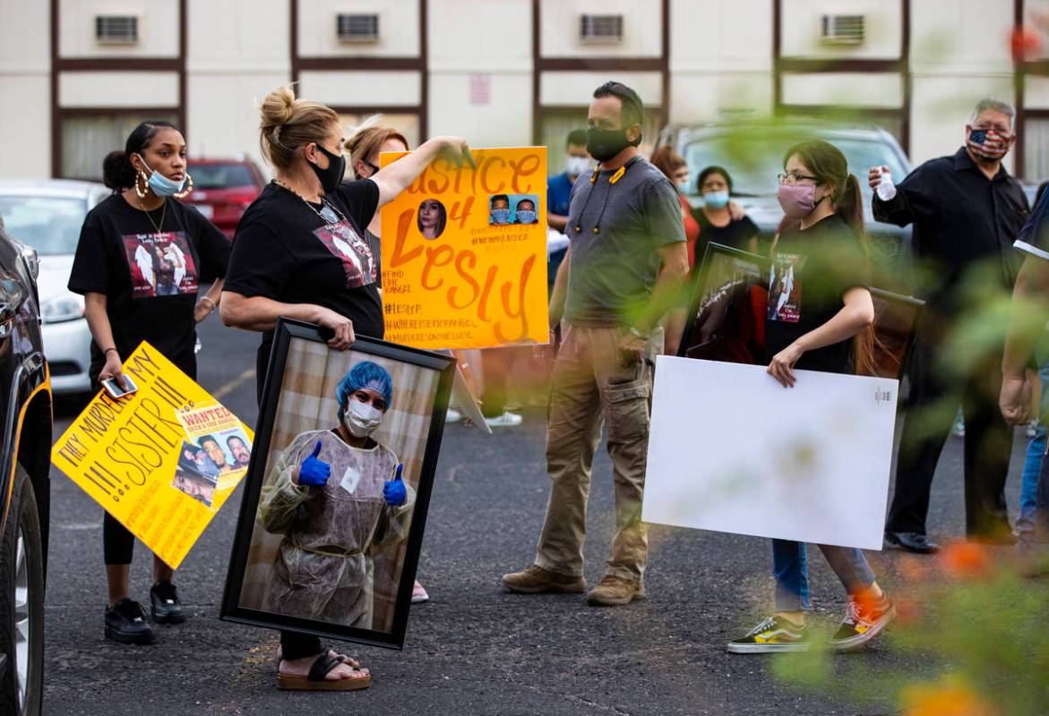Aracely Palacio holds a picture of her daughter, Lesly Palacio, during a gathering in memory of ...