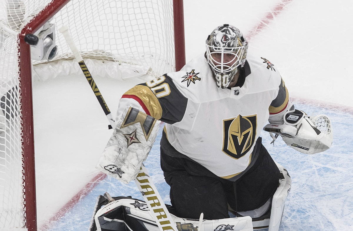 The puck hits the post as Vegas Golden Knights goaltender Robin Lehner watches during the first ...