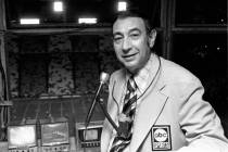 Television sports reporter Howard Cosell poses in the broadcast booth shortly before the Dallas ...