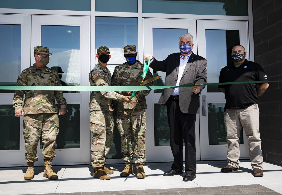 Nevada National Guard Brigadier General Michael Hanifan, from left, Sgt. Sidney Romero, Major G ...