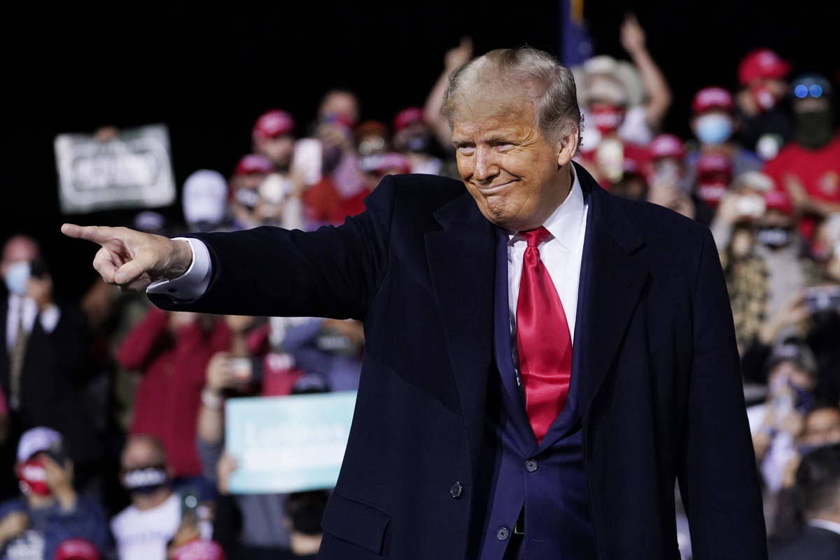 President Donald Trump wraps up his speech at a campaign rally at Fayetteville Regional Airport ...