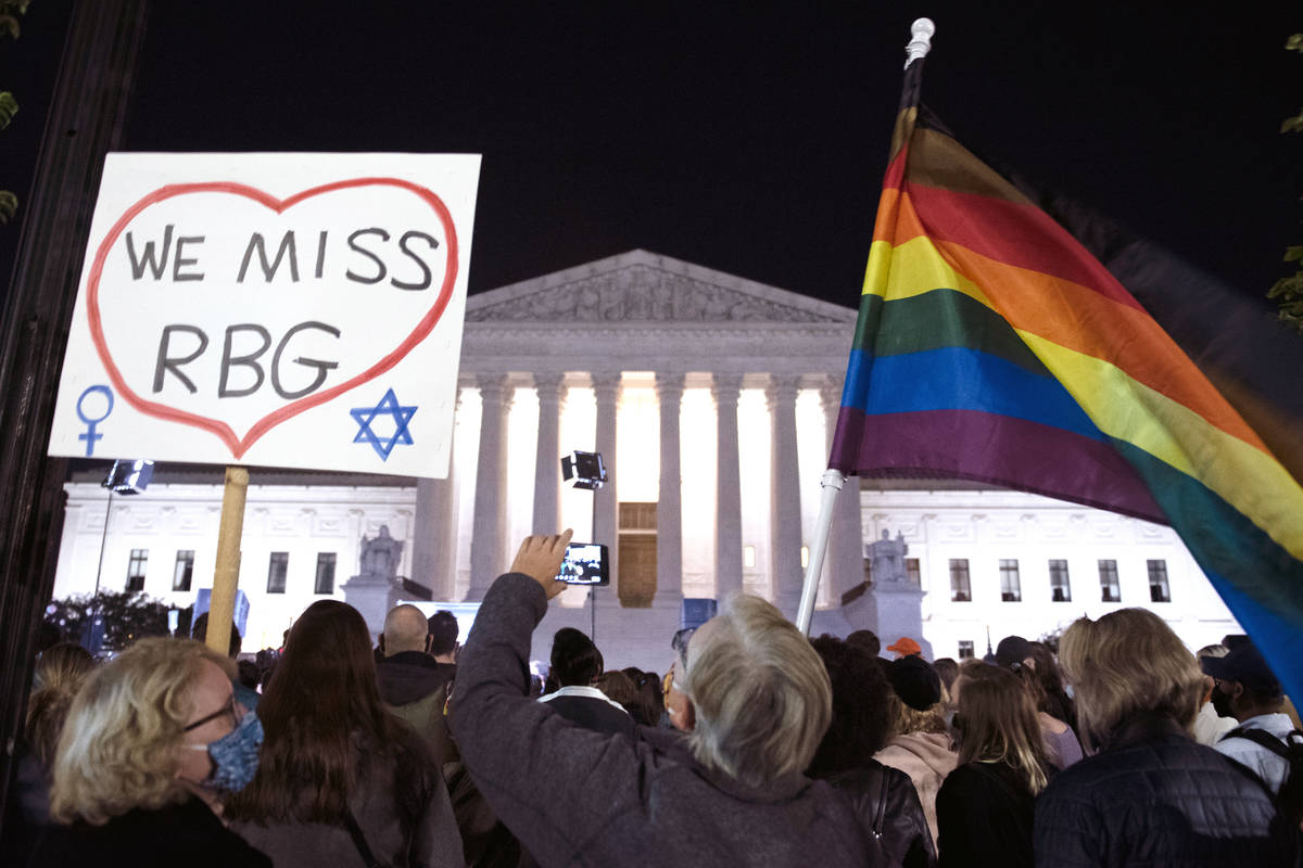People gather at the Supreme Court to honor the late Justice Ruth Bader Ginsburg, Saturday, Sep ...