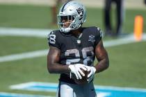 Las Vegas Raiders running back Josh Jacobs (28) stands in the end zone after scoring a touchdow ...