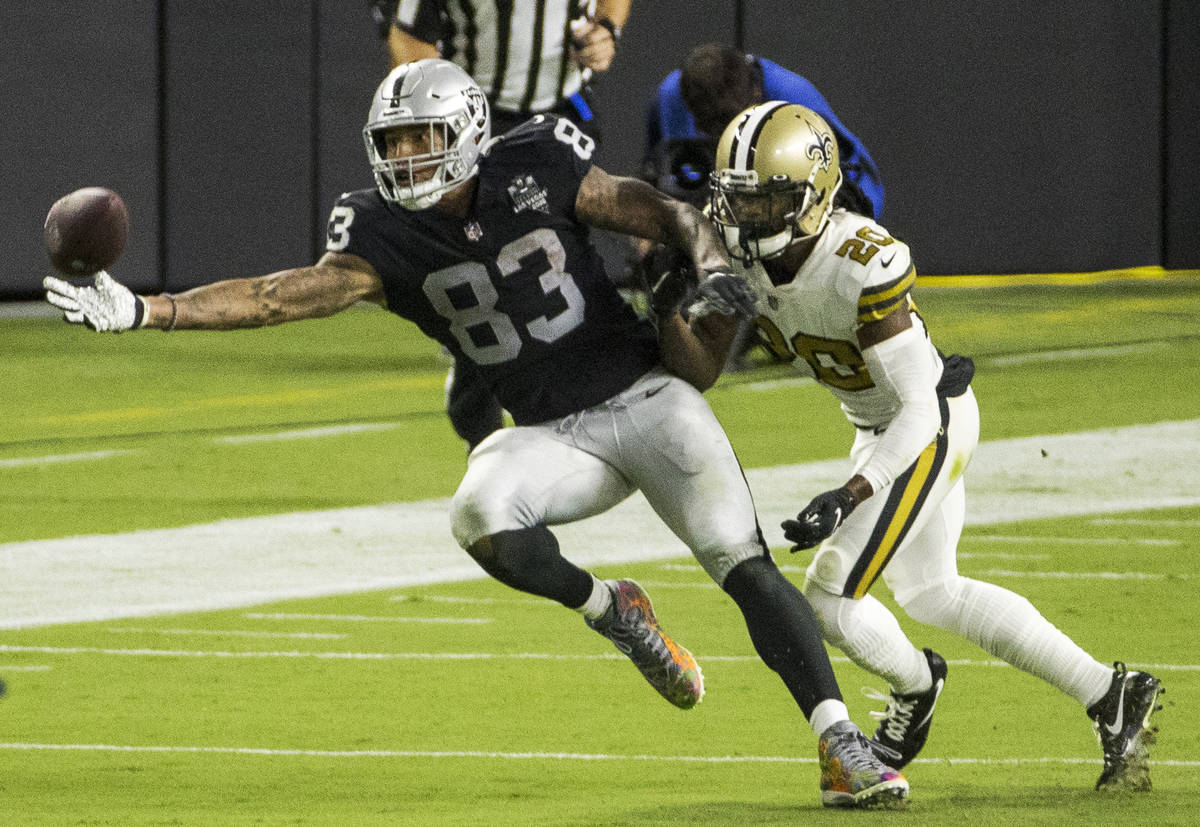 Las Vegas Raiders tight end Darren Waller (83, left) reaches out for critical catch over New Or ...