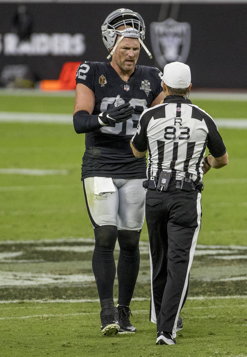 Las Vegas Raiders tight end Jason Witten (82) has a few last words with a referee during a time ...